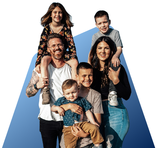 Smiling family of six standing together outdoors