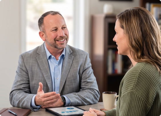 Christopher Smith meeting with a client to review insurance options
